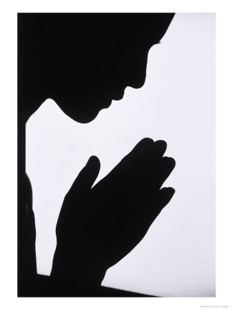 A silhouette of a woman in profile, hands clasped together in prayer against a white background.